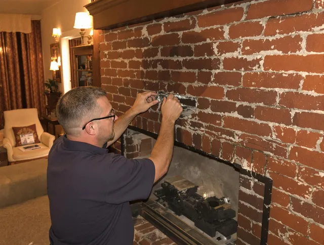 Seal Beach Chimney Sweep expert fixing a fireplace in Seal Beach, CA